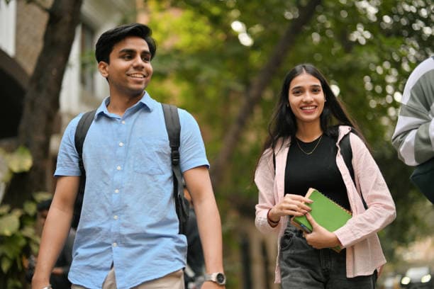 Students walking together on a university pathway