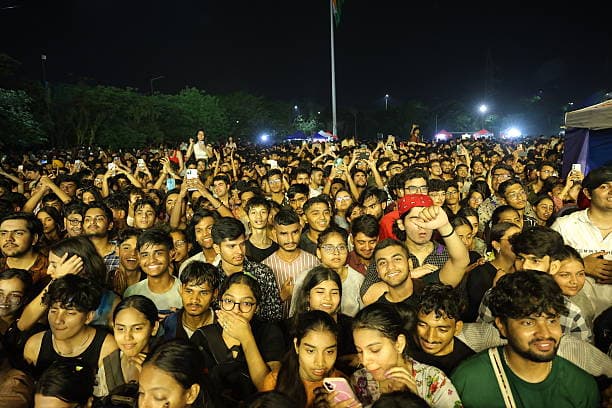A crowd of students enjoying a performance at a campus cultural night